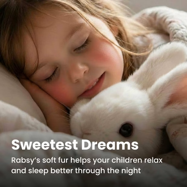 A child settling down to sleep with the Rabsy bunny